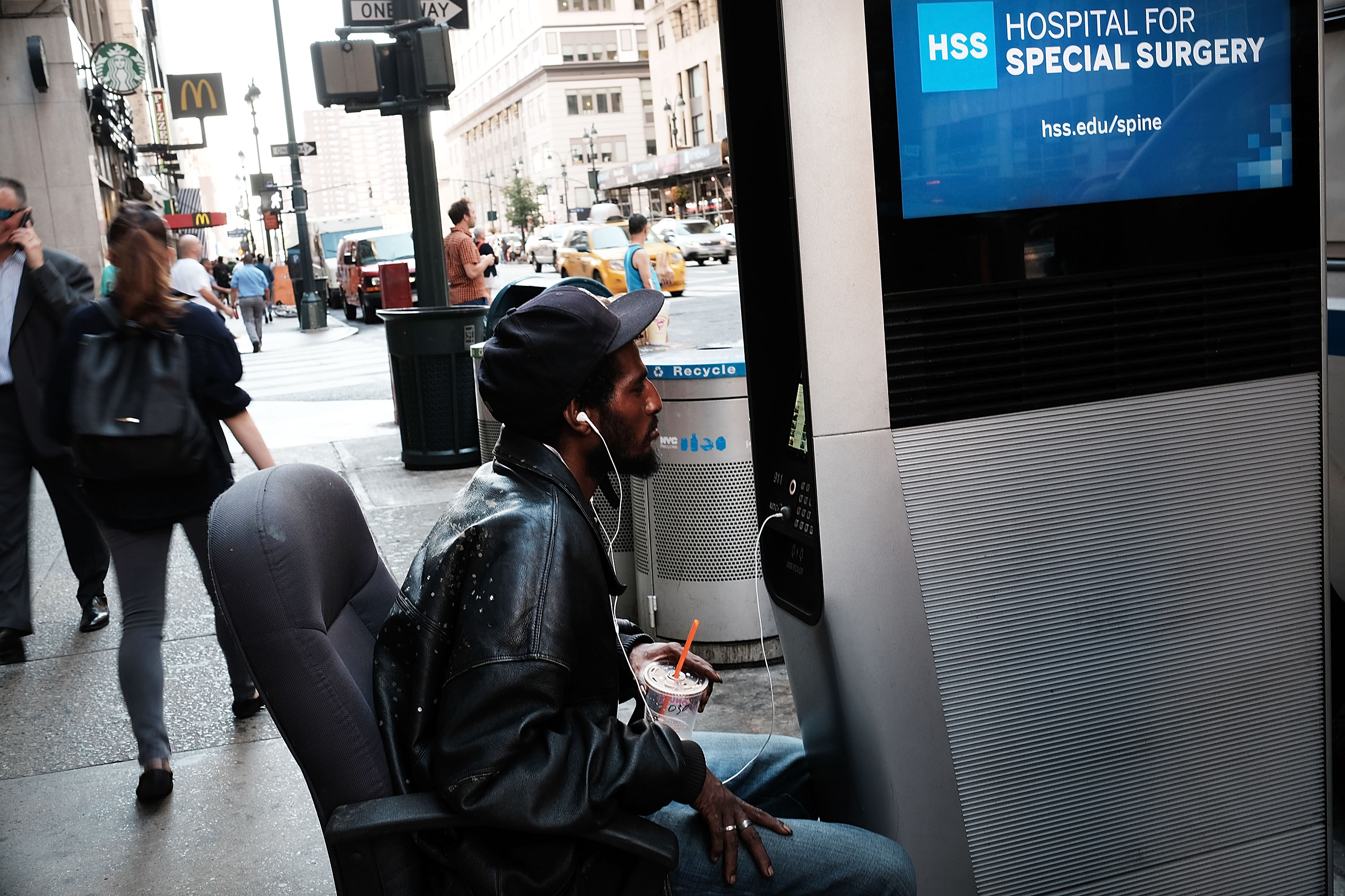 NEW YORK, NY - AUGUST 24: A man uses one of the new Wi-Fi kiosks that offer free web surfing, phone calls and a charging station on August 24, 2016 in New York City. The LinkNYC terminals, which number around 300 in Manhattan, have become especially popular with both the homeless and panhandlers. The free kiosks are being installed to replace obsolete pay phones around Manhattan. (Photo by Spencer Platt/Getty Images)