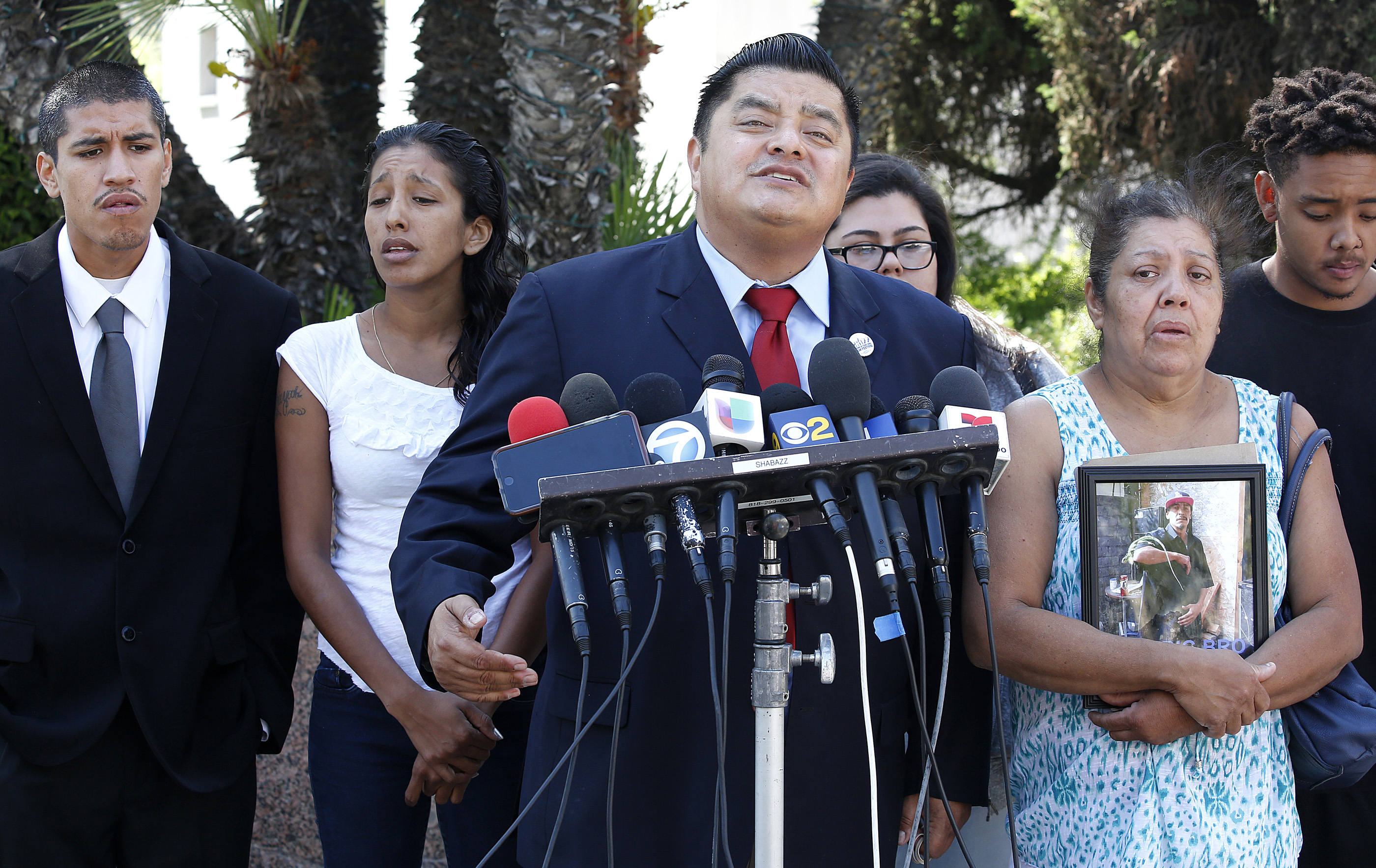 09/01/16/ LOS ANGELES/Attorney Jaime Segall-Gutierrez, joined by family members of David Coborubio, hold a news conference in front of the Kenneth Hahn Hall of Administration, shortly before filing a claim for damages against the Los Angeles County Sheriff's Department, contending Coborubio was ``brutally murdered'' earlier this year during a search of his family's home conducted by theÊFBIÊand sheriff's deputies. (Photo by Aurelia Ventura/ La Opinion)