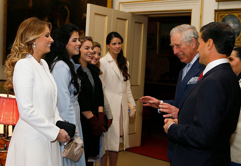 LONDON, ENGLAND - MARCH 03:  Prince Charles, Prince of Wales (2nd R) is introduced to the daughters of Mexico Enrique Pena Nieto (R) and first lady Angelica Rivera during a visit to Clarence House on March 3, 2015 in London, England.  The President of Mexico, accompanied by Senora Angelica Rivera de Pena, are on a State Visit to the United Kingdom as the guests of Her Majesty The Queen from Tuesday 3rd March to Thursday 5th March.  (Photo by Kirsty Wigglesworth - WPA Pool /Getty Images)