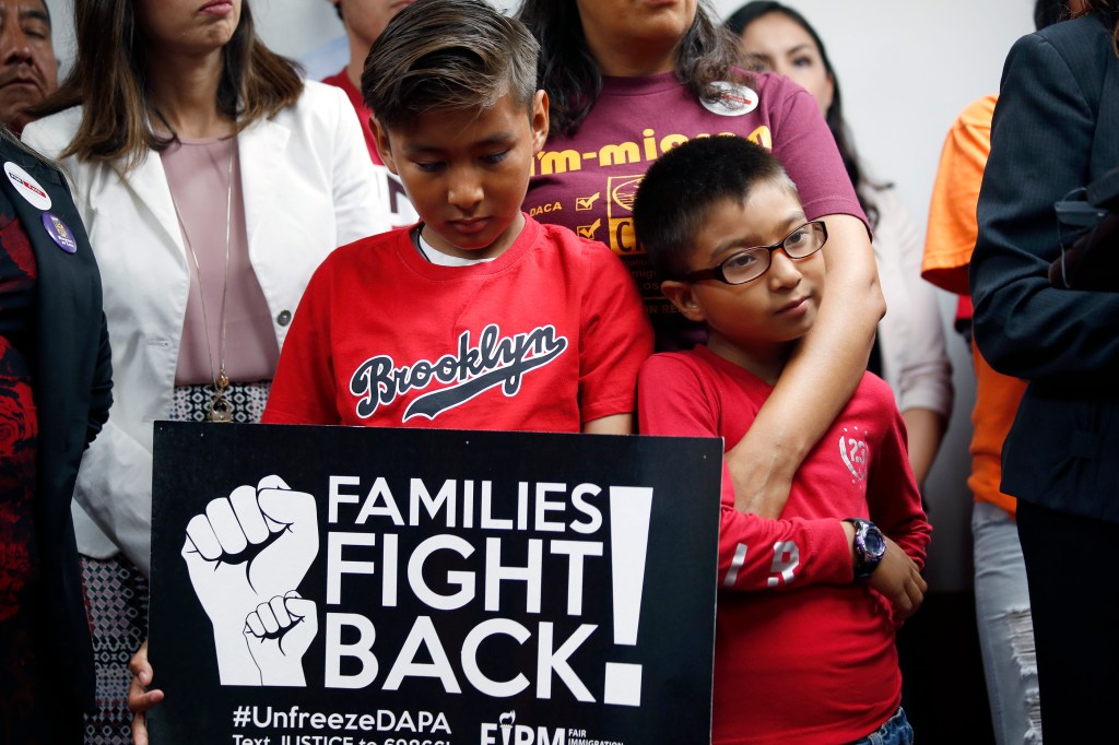 06/23/16/ LOS ANGELES/ Isabel Medina with her children, Jimmy, 9, and Ryan, 7, joined immigrant rights activists and supporters during a press conference in Los Angeles, to discuss the impact on todays Supreme Court judgment on a 4-4 decision in United States v. Texas, the case challenging expanded Deferred Action for Childhood Arrivals (DACA) and Deferred Action for Parents of Americans and Lawful Permanent Residents (DAPA). The decision is a huge disappointment for immigrant families and their defenders.Ê (Photo Aurelia Ventura/ La Opinion)