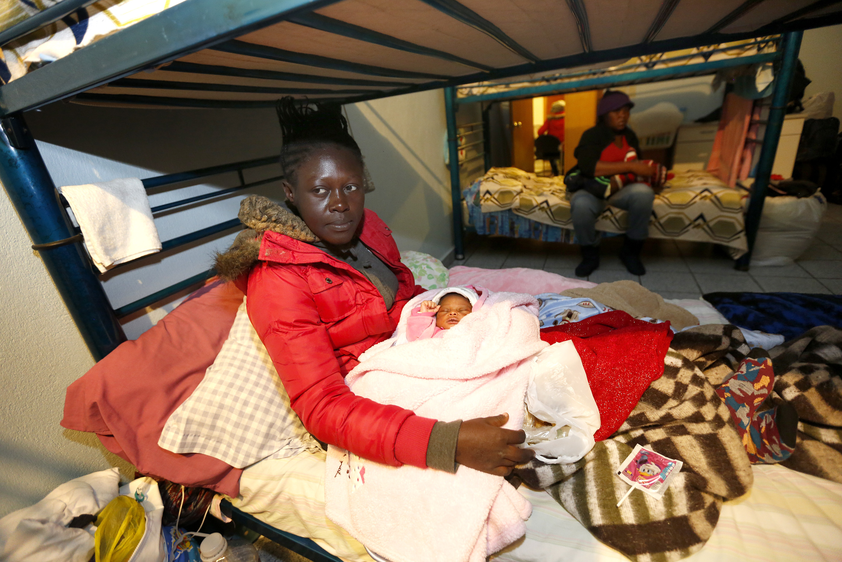 12/08/16/ TIJUANA/Haitian refugee Rosehie Su-Baptiste with her new born daughter, seek shelter at Centro Madre Assunta in Tijuana. An unprecedented arrival of Haitians and others seeking entry into the United States in recent weeks has sent Tijuanas migrant shelters scrambling to find beds, blankets, food and other necessities to serve this increase of people awaiting processing by U.S. authorities. (Photo Aurelia Ventura/ La Opinion)