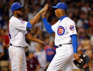 Dexter Fowler (izq.) y Aroldis Chapman (der.) podrían cambiar de aires para la siguiente temporada. 